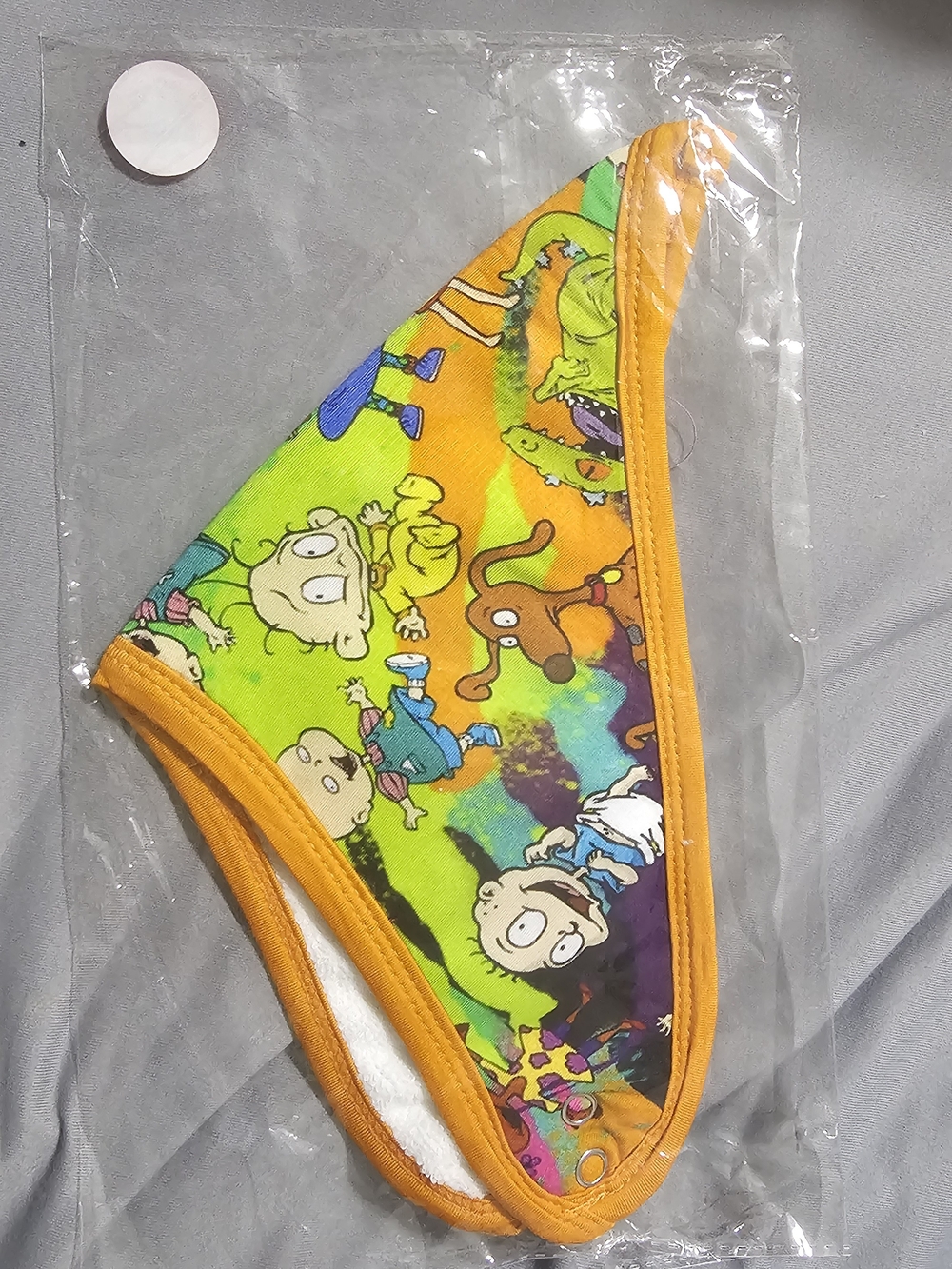 Colorful Kids Bib with Cartoon Print in Bright Green & Orange Bamboo Outside